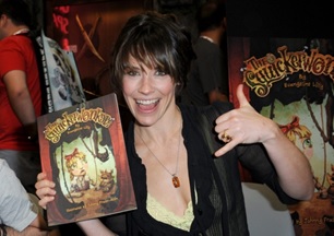 Evangeline holding a copy of her book